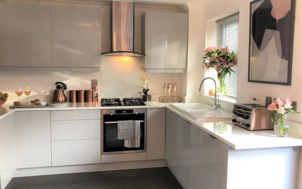 white kitchen units and doors at the bottom with grey top units and white quartz worktop 2
