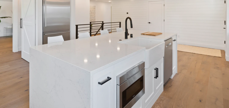 white kitchen island made with quartz marble worktop