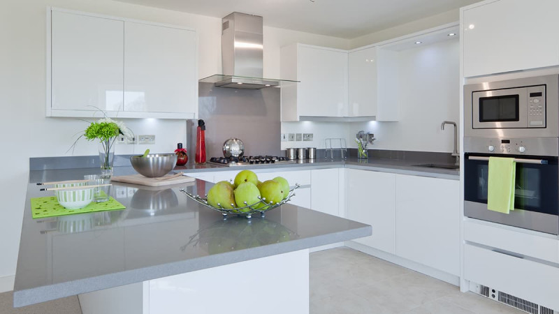 white gloss acrylic kitchen units with grey marble worktop