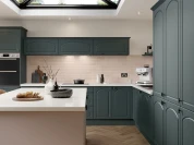Barcelona curved arch doors in heritage green and dusky pink with pure white worktop