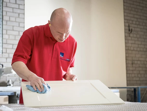 kitchen fitter in factory checking door