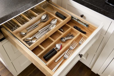 open kitchen drawer displaying cutlery