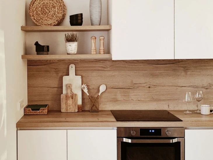 Kitchen corner, shelves with accessories, wooden worktop with sink