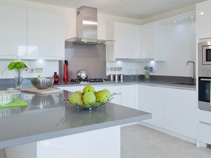 white gloss acrylic kitchen units with grey marble worktop